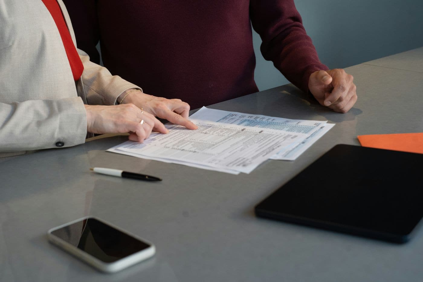 Commercial documents being reviewed as part of a structured deal